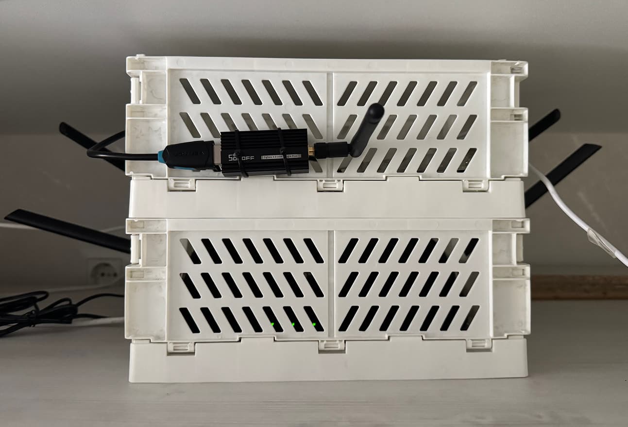 Server and router tucked into a plastic enclosure